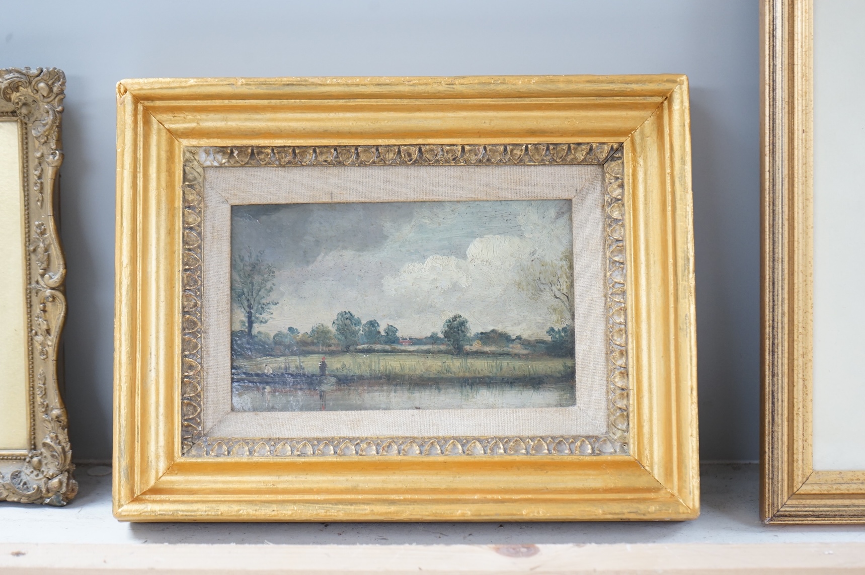 Late 19th / early 20th century, miniature oil on board, Riverscape with figures, 10 x 16.5cm, gilt framed